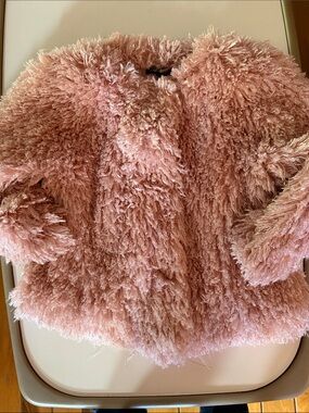 Melissa Paige shaggy pink faux fur jacket. Snaps in front. Size Large.